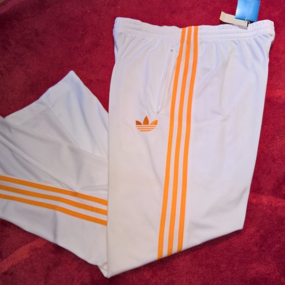 orange and white adidas pants